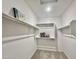 Spacious walk-in closet with shelving and rods at 746 E Doral Ave # 201, Gilbert, AZ 85297