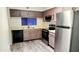 Modern kitchen with stainless steel appliances and updated cabinetry at 1319 E Marny Rd, Tempe, AZ 85288