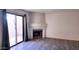 Living room with fireplace and sliding door to patio at 1319 E Marny Rd, Tempe, AZ 85288