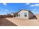 Spacious backyard featuring a covered patio and ample room for landscaping, ideal for creating an outdoor living area at 16555 N Lunar St, Maricopa, AZ 85138