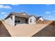 Expansive backyard with a covered patio, offering a versatile outdoor space ready for landscaping and personalization at 16555 N Lunar St, Maricopa, AZ 85138