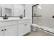 Modern bathroom with glass enclosed shower and dual sink vanity at 16555 N Lunar St, Maricopa, AZ 85138