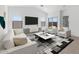 Bright living room featuring recessed lights, neutral colors, and modern furnishings at 16555 N Lunar St, Maricopa, AZ 85138