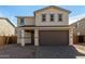 Two-story home featuring a front-entry, two-car garage and neutral color palette at 11628 W Beck Dr, Youngtown, AZ 85363