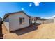 Backyard view of new home with covered patio at 18440 W Monte Lindo Ln, Surprise, AZ 85387