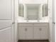 Bright bathroom featuring quartz countertops, double sinks, and modern fixtures at 18440 W Monte Lindo Ln, Surprise, AZ 85387