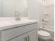 Bathroom with modern sink, quartz countertops, and a bathtub shower combo at 18440 W Monte Lindo Ln, Surprise, AZ 85387