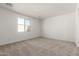 Bedroom with carpet flooring and window at 18440 W Monte Lindo Ln, Surprise, AZ 85387