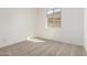 Bedroom featuring neutral carpet, bright window, and natural light at 18440 W Monte Lindo Ln, Surprise, AZ 85387