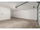 Spacious two-car garage with bright lighting at 18440 W Monte Lindo Ln, Surprise, AZ 85387
