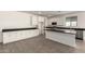 Bright kitchen with stainless steel appliances, a center island, and white cabinets at 18440 W Monte Lindo Ln, Surprise, AZ 85387