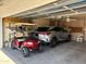 Spacious two-car garage with golf cart and ample storage at 2225 S Olivewood --, Mesa, AZ 85209