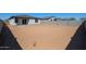The spacious backyard features sand and block walls, ready for landscaping at 35315 W La Paz St, Maricopa, AZ 85138