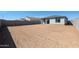 Large backyard area ready to landscape with block wall for privacy at 35315 W La Paz St, Maricopa, AZ 85138