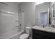 Clean bathroom with a shower-tub combo and a vanity at 35315 W La Paz St, Maricopa, AZ 85138