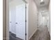 Hallway with several doors leading to various rooms, offering a glimpse of the home's layout at 35315 W La Paz St, Maricopa, AZ 85138