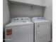 Laundry room featuring a Whirlpool washer and dryer at 35315 W La Paz St, Maricopa, AZ 85138