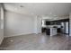Spacious open-concept living room, with natural light and seamless flow into the modern kitchen at 35315 W La Paz St, Maricopa, AZ 85138