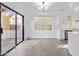 Bright dining area featuring modern lighting, sliding glass door and wood-look floors at 4130 W Irwin Ave, Phoenix, AZ 85041