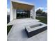 Backyard patio featuring a built-in gas fire pit and modern architecture at 4414 N 29Th St, Phoenix, AZ 85016