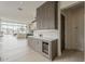Stylish bar area features sleek gray cabinets, a wine fridge, and modern subway tile backsplash, perfect for entertaining at 4414 N 29Th St, Phoenix, AZ 85016