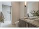 Modern bathroom featuring a shower with tile surround, neutral walls, and sleek fixtures at 4414 N 29Th St, Phoenix, AZ 85016