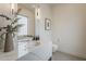 Contemporary half-bathroom with marble countertop, modern lighting, and floating toilet at 4414 N 29Th St, Phoenix, AZ 85016