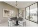 Dining room with large windows, sleek table, and view of the outdoor area at 4414 N 29Th St, Phoenix, AZ 85016