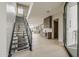 Modern entryway with open staircase, light wood floors, and views of the living area at 4414 N 29Th St, Phoenix, AZ 85016