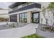 Close up of a modern home's front entrance featuring a sleek walkway and desert-style landscaping at 4414 N 29Th St, Phoenix, AZ 85016