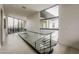 Bright hallway with wood floors and glass railing at 4414 N 29Th St, Phoenix, AZ 85016