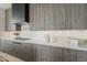 Modern kitchen boasts sleek cabinetry, stainless steel appliances, and quartz countertops, perfect for culinary enthusiasts at 4414 N 29Th St, Phoenix, AZ 85016