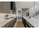 Modern kitchen with stainless steel appliances, quartz countertops, sleek cabinetry, and seamless integration with living areas at 4414 N 29Th St, Phoenix, AZ 85016