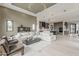 Expansive living room with an open floor plan, modern lighting, and seamless transition to the kitchen at 4414 N 29Th St, Phoenix, AZ 85016