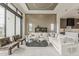 Spacious living room with large windows, modern decor, and an open concept design leading to the kitchen at 4414 N 29Th St, Phoenix, AZ 85016