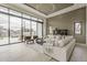Bright living room features floor-to-ceiling windows, contemporary decor, and a view of the outdoor patio area at 4414 N 29Th St, Phoenix, AZ 85016