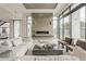 Contemporary living room boasts a sleek fireplace, ample natural light, and comfortable seating arrangements at 4414 N 29Th St, Phoenix, AZ 85016