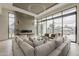 Light-filled living room with fireplace, expansive windows, and elegant furnishings, offering a welcoming ambiance at 4414 N 29Th St, Phoenix, AZ 85016