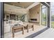 Bright living room with a fireplace, modern lighting, and sliding glass doors opening to the outdoor space at 4414 N 29Th St, Phoenix, AZ 85016