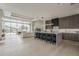 Spacious living area integrates kitchen and living room with modern design, expansive windows, and seamless indoor-outdoor flow at 4414 N 29Th St, Phoenix, AZ 85016