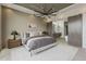 Main bedroom features a luxurious bed, stylish lighting, and a sliding door into the bathroom at 4414 N 29Th St, Phoenix, AZ 85016