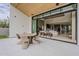 Inviting outdoor patio features a dining area with comfortable seating and access to the home's open-concept living space at 4414 N 29Th St, Phoenix, AZ 85016
