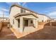 Backyard featuring a covered patio, dirt landscaping, and block wall at 11624 W Beck Dr, Youngtown, AZ 85363