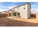 Backyard featuring a covered patio, dirt landscaping at 11624 W Beck Dr, Youngtown, AZ 85363