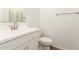 Clean bathroom with white vanity, sink, and toilet in a well-lit space at 11624 W Beck Dr, Youngtown, AZ 85363