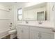 Bright bathroom with double sink vanity, large mirror, and shower over tub at 11624 W Beck Dr, Youngtown, AZ 85363