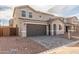 Exterior view of a two-story home with a two-car garage at 11624 W Beck Dr, Youngtown, AZ 85363