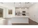 Bright kitchen featuring an island, stainless steel appliances, and white cabinetry at 11624 W Beck Dr, Youngtown, AZ 85363