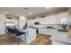 Modern kitchen with white cabinets, quartz countertops, and stainless steel appliances at 12712 W Corona Ave, Avondale, AZ 85392