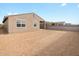 Large backyard with block fencing, a covered patio and space for outdoor living at 16001 W Cottontail Ln, Surprise, AZ 85387